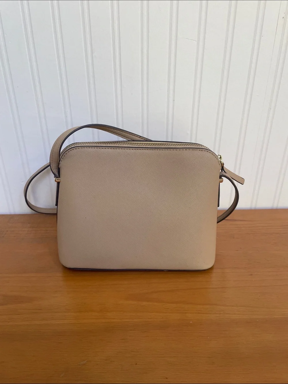 Kate Spade tan crossbody with floral, butterfly and fruit accents